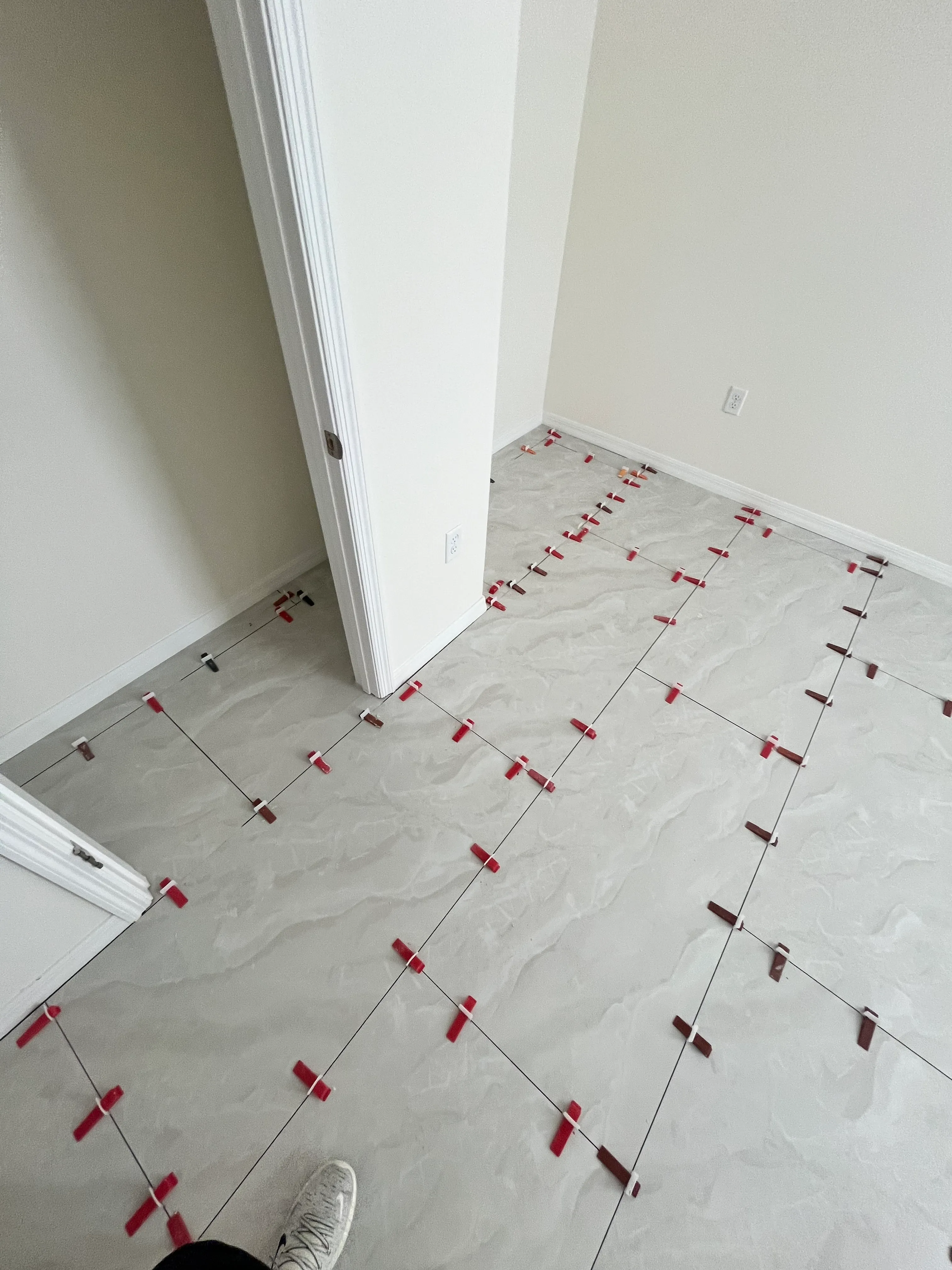Bedroom 1 tile flooring installation in process, close-up, Wind Meadows South, Bartow, FL