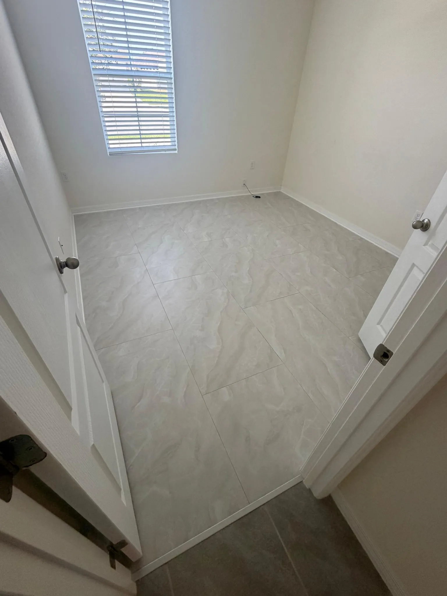 Bedroom 2 after tile flooring installation in Wind Meadows South, Bartow, FL