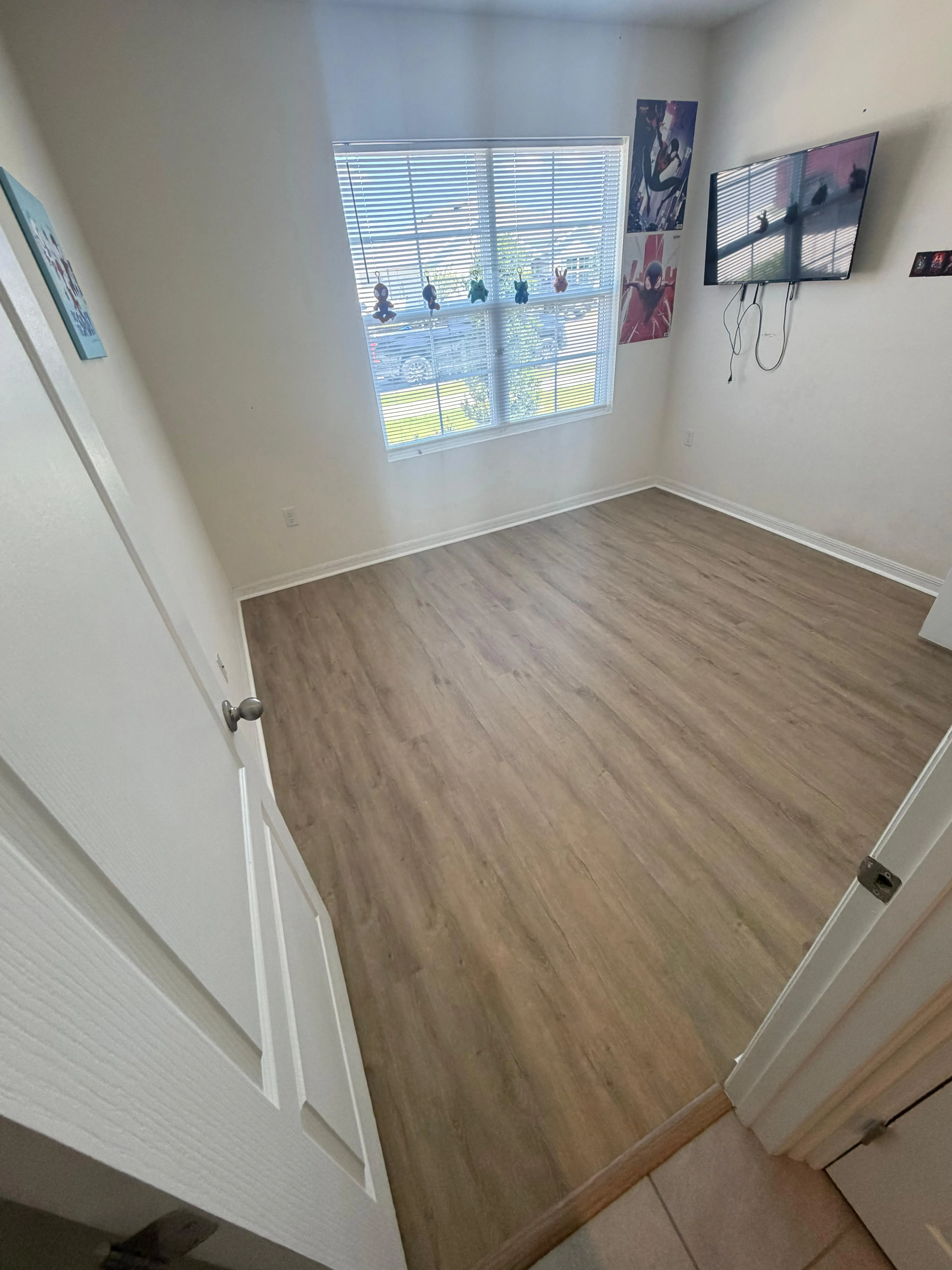 Bedroom after LVP flooring installation in Wind Meadows South, Bartow, FL