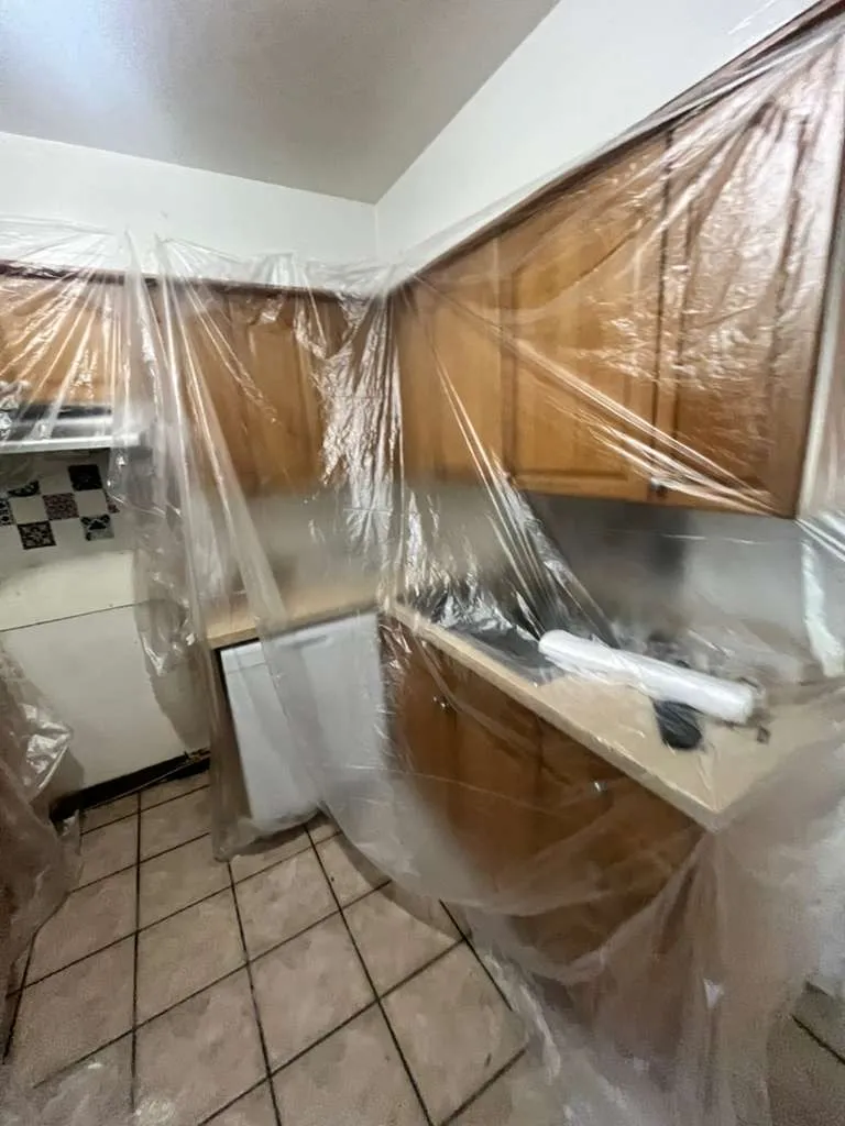 Cabinets protected before tile removal for a clean lvp flooring installation in East Lake Morton, Lakeland, FL