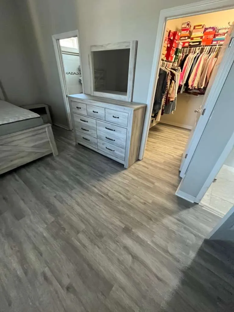 Master bedroom closet after LVP flooring installation in Fountain Park, Polk City, FL