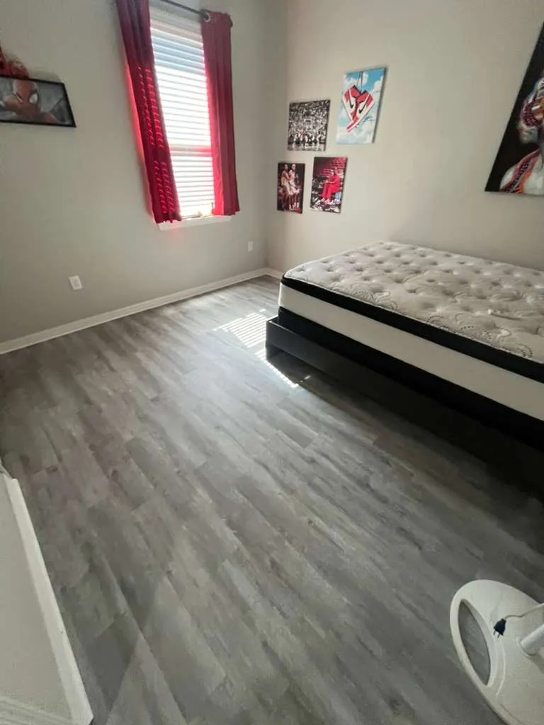 Bedroom 1 after LVP flooring installation in Fountain Park, Polk City, FL