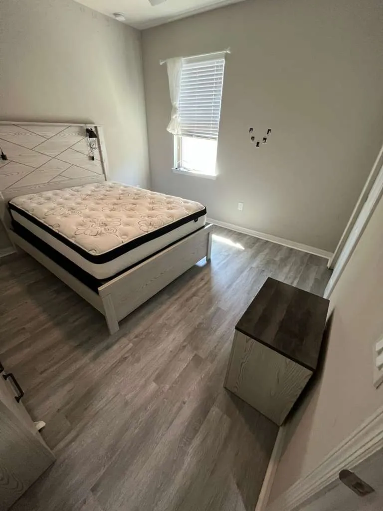 Bedroom 2 after LVP flooring installation in Fountain Park, Polk City, FL