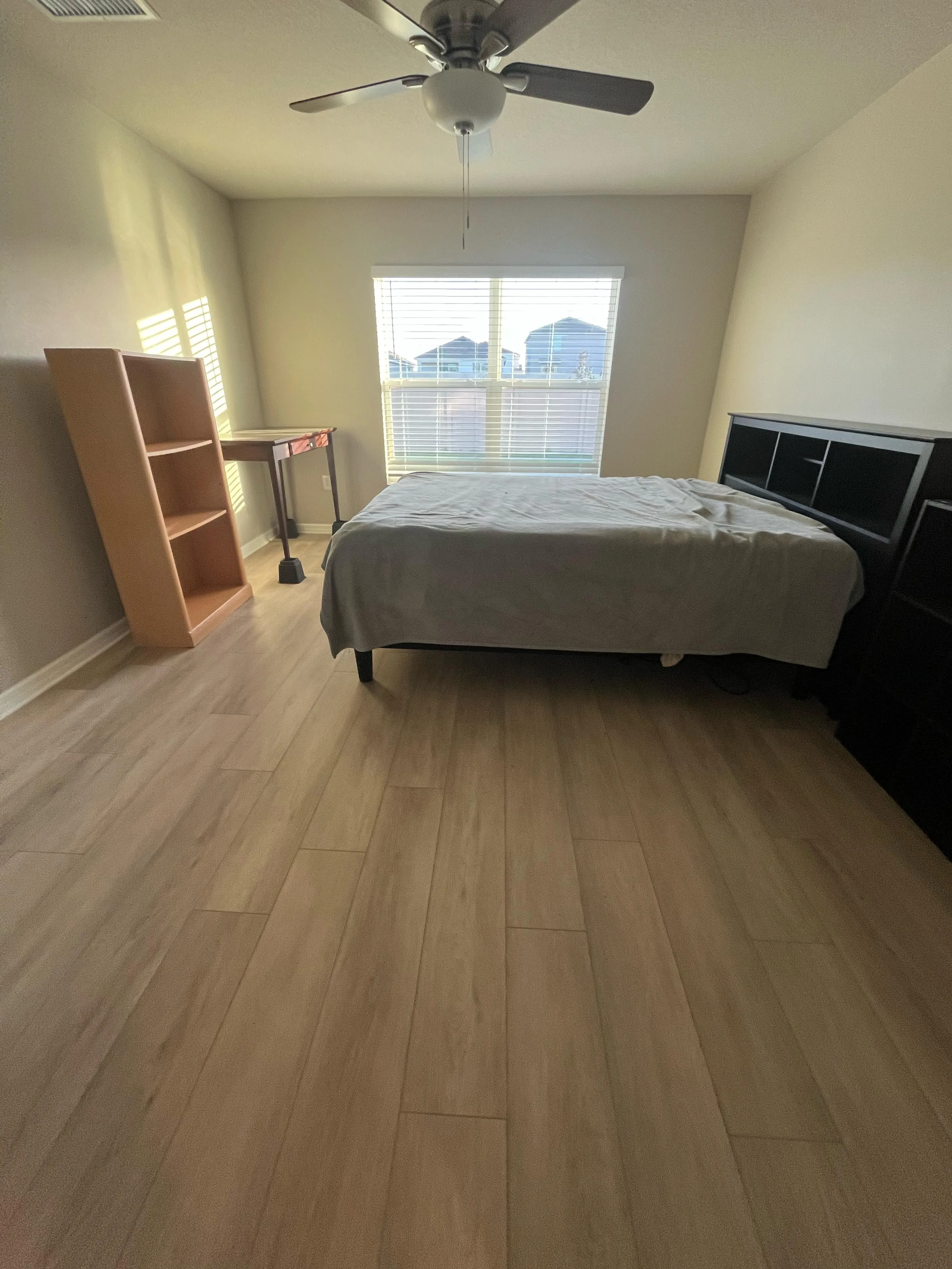 Master bedroom after laminate flooring installation in Brandon, FL