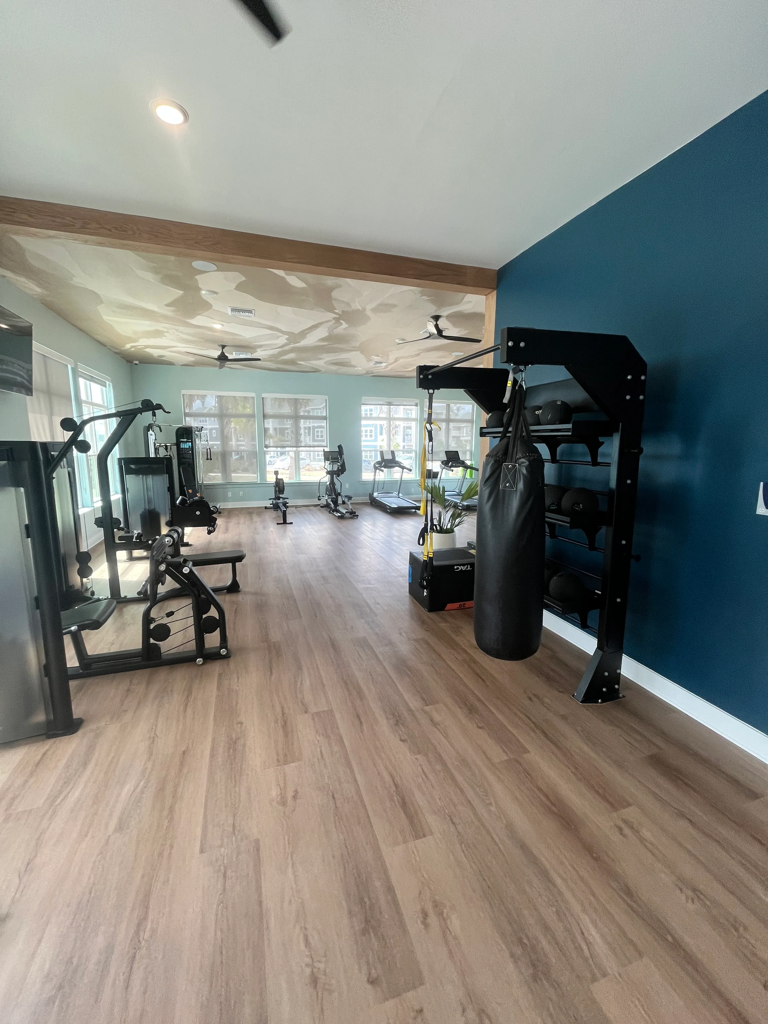 Clubhouse gym after LVP flooring installation at The Mark at Wildwood, Oxford, FL
