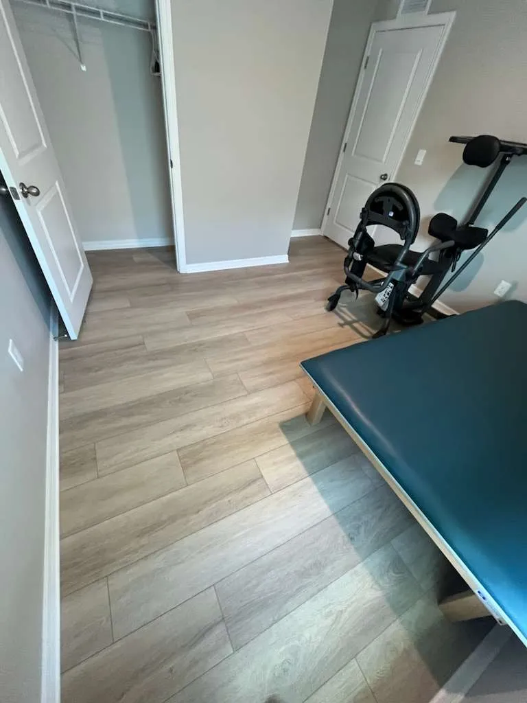 Second bedroom after laminate flooring installation in Brandon, FL